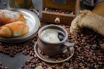 Black coffee on an old background in a cup