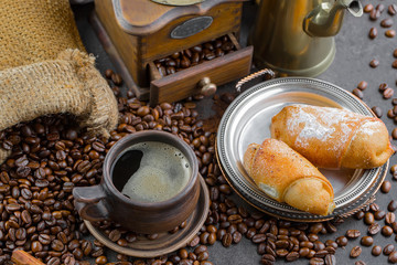 Black coffee on an old background in a cup