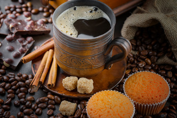 Black coffee on an old background in a cup