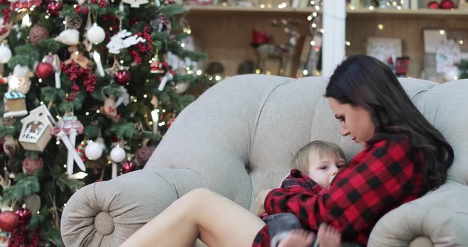 Mom breastfeeds her son