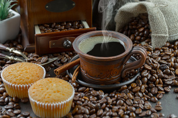 Coffee in a cup and saucer on an old background.