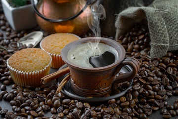 Coffee in a cup and saucer on an old background.