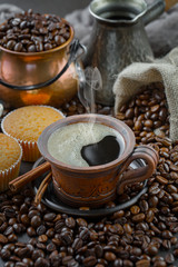 Black coffee on an old background in a cup
