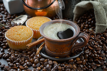 Black coffee on an old background in a cup