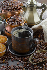 Black coffee on an old background in a cup