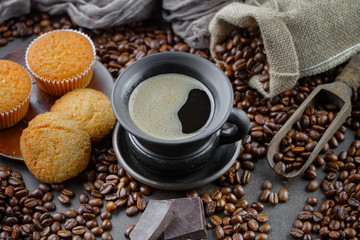 Black coffee beans on an old backgroundм