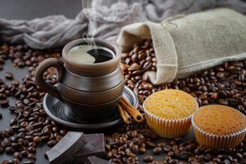 Coffee in a cup and saucer on an old background.