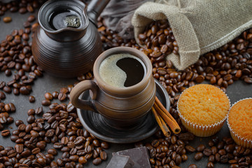 Coffee beans are roasted in a pan with smoke.