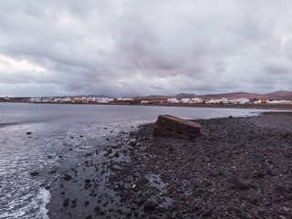 stone beach with clouds