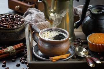 Black coffee on an old background in a cup