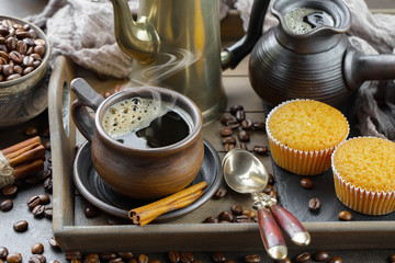 Black coffee on an old background in a cup