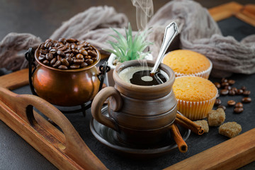 Black coffee on an old background in a cup