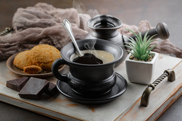 Black coffee on an old background in a cup