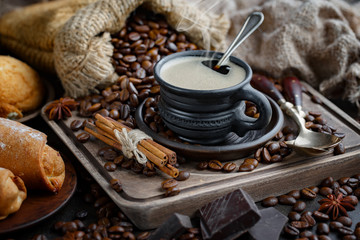 Black coffee on an old background in a cup