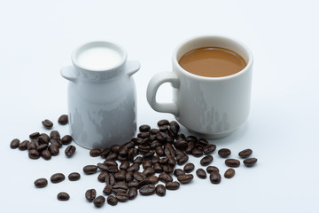 Milk coffee in a ceramic cup on a white background