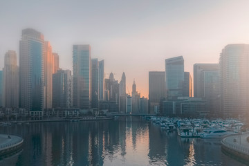Foggy morning in Dubai. Urban morning landscape.
