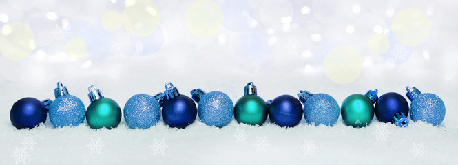 Christmas themed banner with Christmas baubles and snow