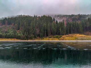Autumn landscape background in the rain weather with fog