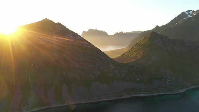 aerial view. sunset over Veggen and Mannen peaks, Haukland and Uttakleiv Beach in the Norway on the Lofoten Islands