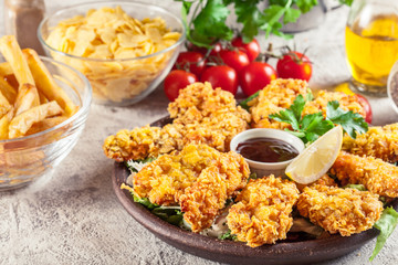 Chicken strips in cornflakes breadcrumb