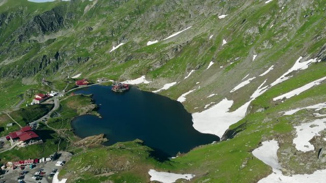 Top view Lake Balea on Transfagaras pass in Carpathian mountains Romania, slider shot
