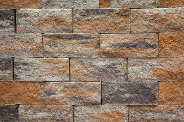Artificial decorative stone on the building. Backgrounds and textures