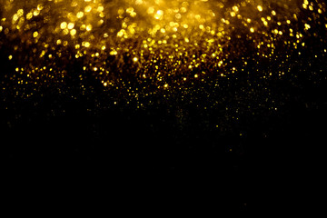 golden glitter bokeh lighting texture Blurred abstract background for birthday, anniversary, wedding, new year eve or Christmas