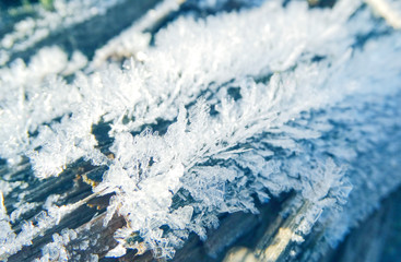 winter background with snowflakes crystals patterns and snow on frozen grass