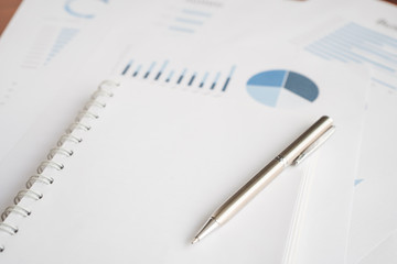 Business document report data with bar charts, pie charts, line graphs, on paper. Research data for market analysis and corporate financial planning.