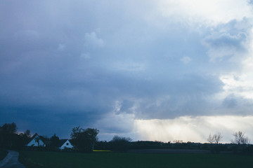 Fototapeta na wymiar dramatic sky and clouds view in village