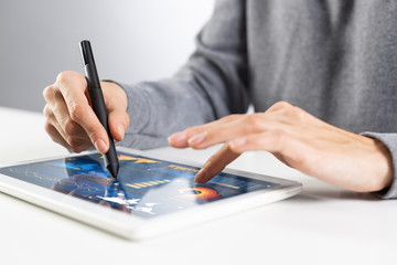 Fototapeta premium Close-up of female hands touching screen of tablet