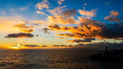 Sunset with blue sky on the ocean