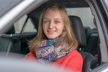 Plakat portrait pretty youth woman driving car with open window