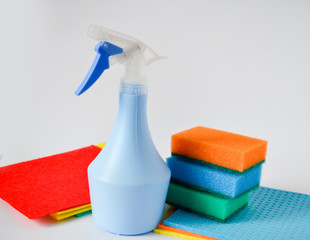 Cleaning set for different surfaces in kitchen, bathroom and other rooms. spray bottle with Shape Sponge and kitchen rags. flat lay, top view. Cleaning service concept. Early spring regular clean up.