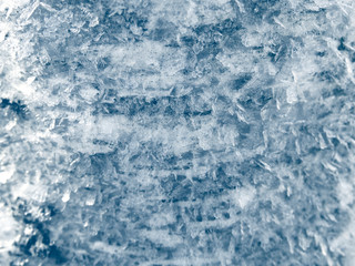 winter background with snowflakes crystals patterns and snow on frozen grass
