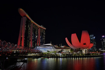 Singapore - January 4 2019: Art Science Museum, Helix Bridge and Marina Bay Sands are red in the night