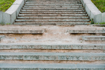 Big broken stairs in the the park made from concrete. Dangerous. Unsafe. Warning. Step. Abandoned....