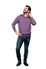 Fototapeta premium Full-length shot of Handsome man with sweatshirt thinking an idea over isolated white background