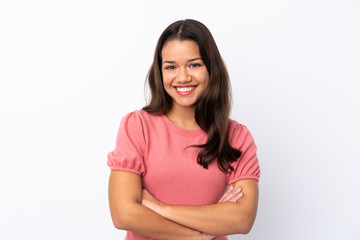 Fototapeta premium Young Colombian girl over isolated white background keeping the arms crossed in frontal position