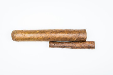Two best cigars from twisted sheets on white background.