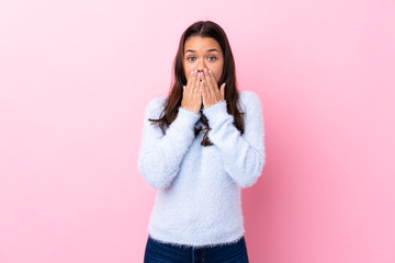 Young Colombian girl over isolated pink background with surprise facial expression