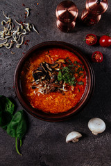 Chickpea soup, vegan. Served in a bow. Gray, structural background. Flat lay food.