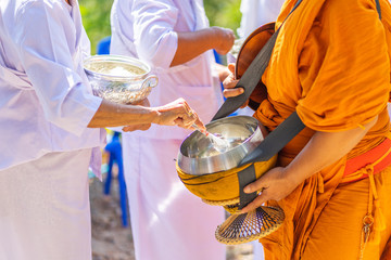 The monks of the Buddhist Sangha(give alms to a Buddhist monk), which came out of the Buddhist offerings in the morning. In order to demonstrate faith faithfully perform the duties recently.
