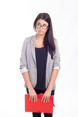 beautiful young businesswoman with a red folder looking on the side