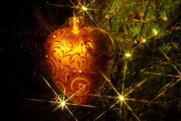 Christmas bauble on the Christmas tree with sparks lights Christmas garland