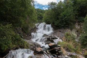 Closeup view waterfall scene in mountains, national park of Dombay, Caucasus