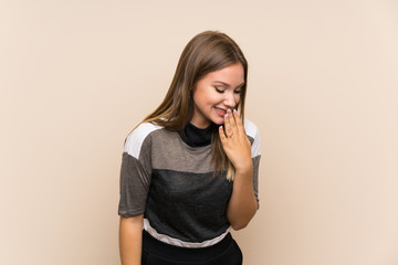 Teenager girl over isolated background smiling a lot