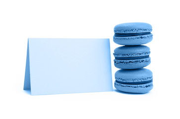 Fototapeta na wymiar Blue macaron cookies with sign isolated on white