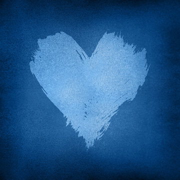 White watercolor painted heart shape over dark blue