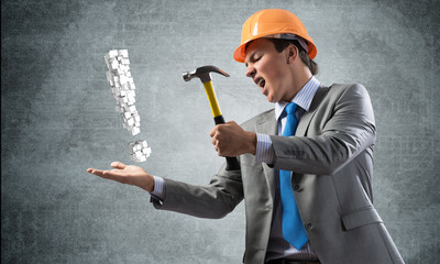 Businessman going to crash exclamation mark